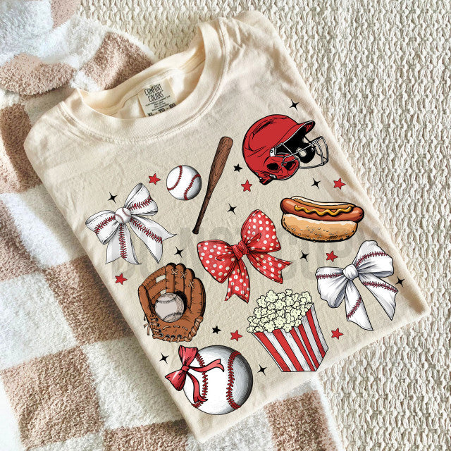 Folded cream-colored sweatshirt with sports-themed graphics on a textured surface