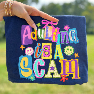 Navy blue bag with colorful text held by a hand outdoors