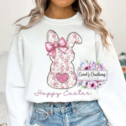 White sweatshirt with floral bunny design and 'Happy Easter' text, worn by a person.