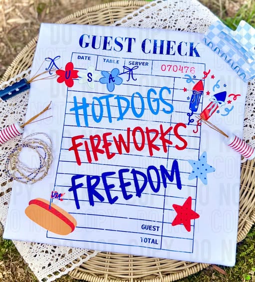Handwritten 'Guest Check' with 'Hotdogs, Fireworks, Freedom' text on a white background.