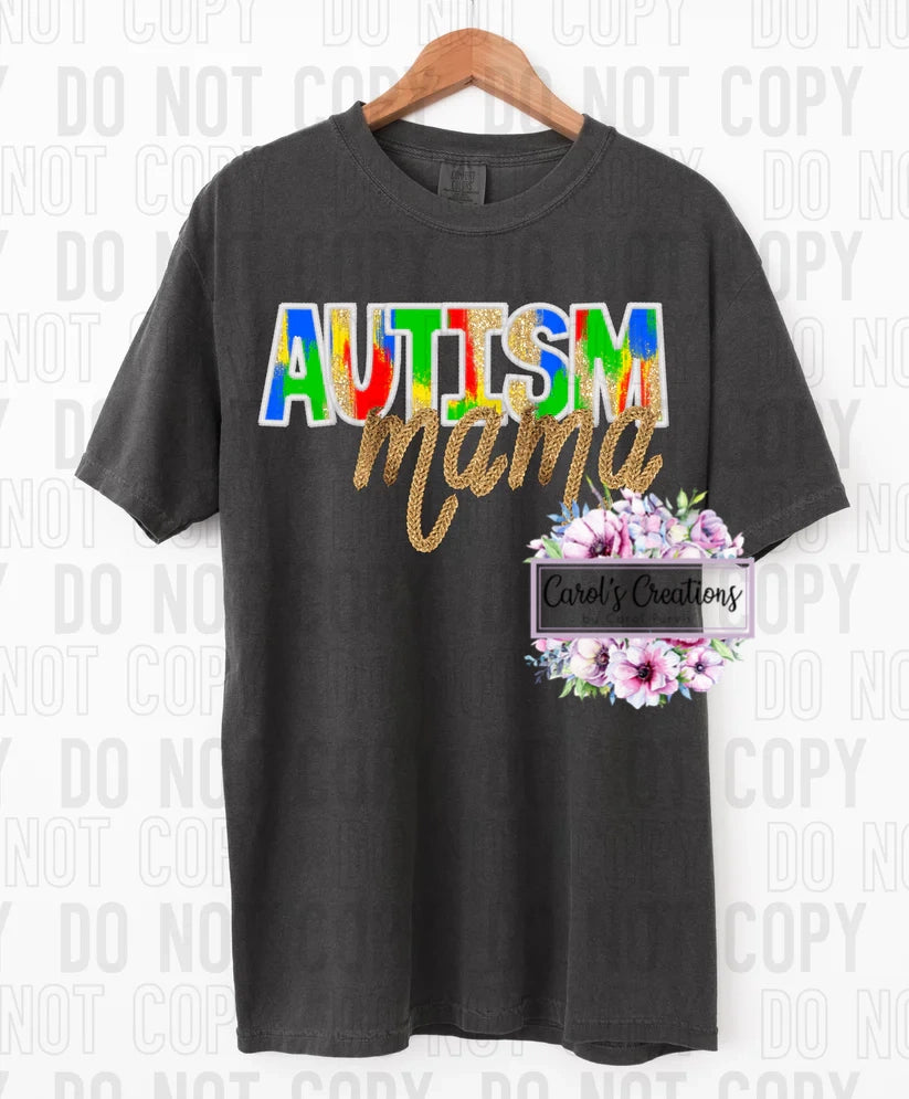 Black t-shirt with 'Autism Mama' text and floral design on a white background