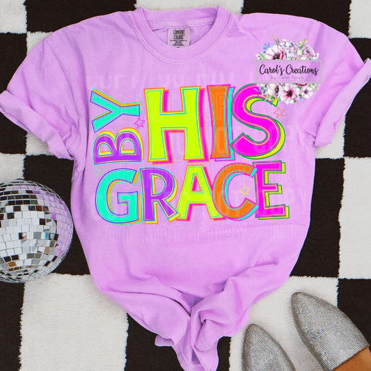 Purple t-shirt with 'BY HIS GRACE' text on a checkered background