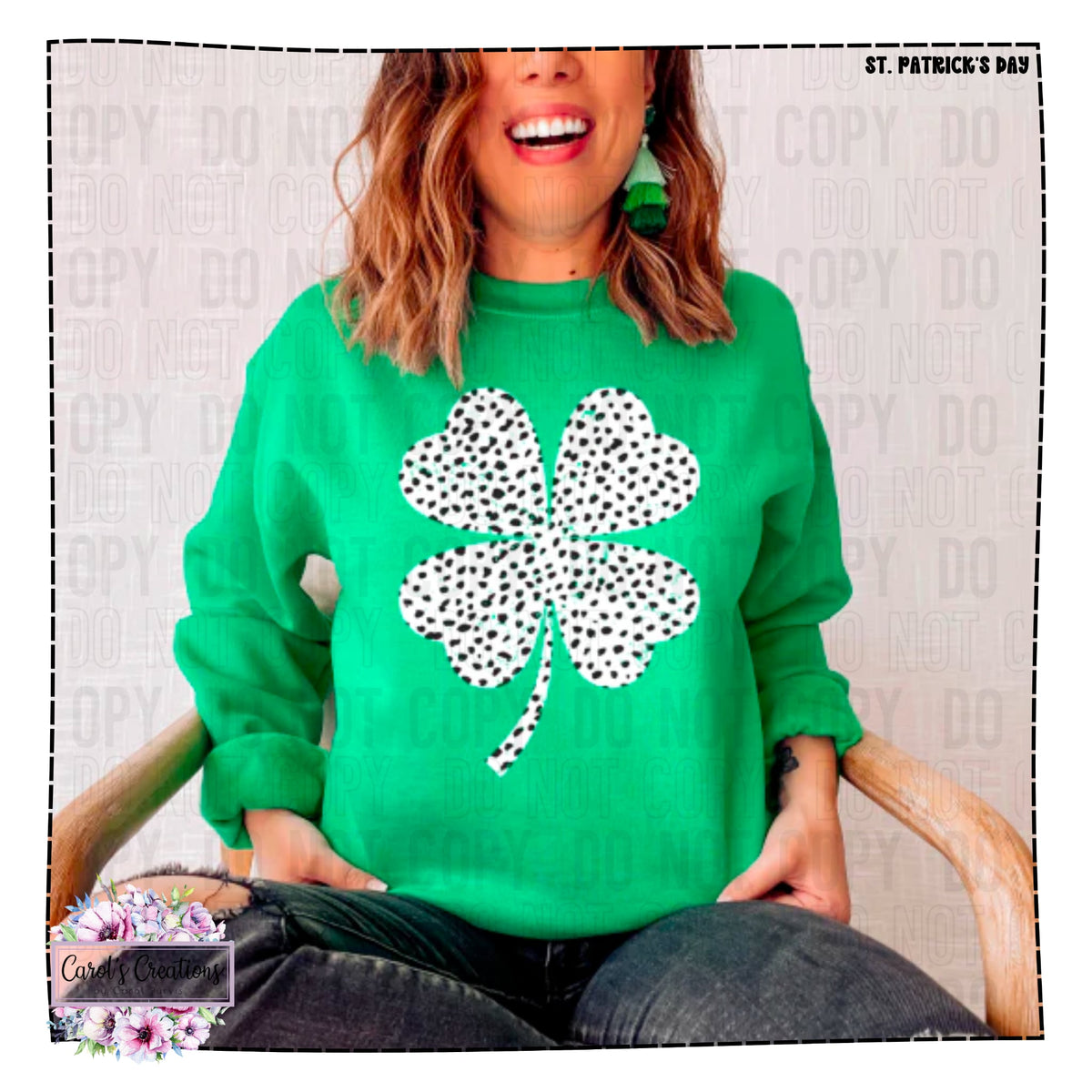 Person wearing a green sweater with a black and white shamrock design, sitting on a chair.