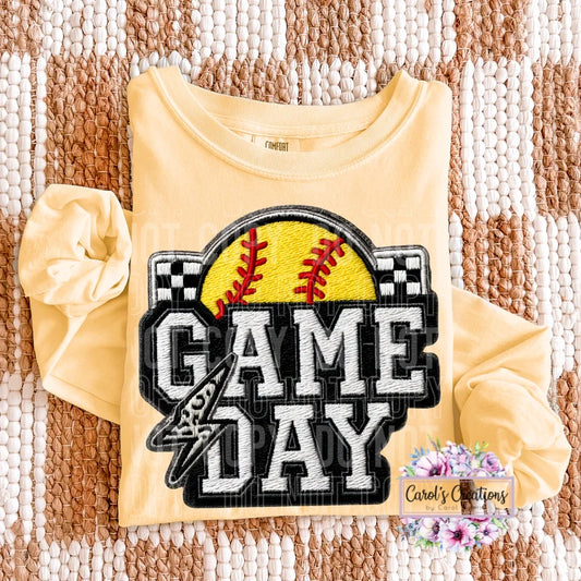 Yellow shirt with 'Game Day' and softball design on a textured fabric background