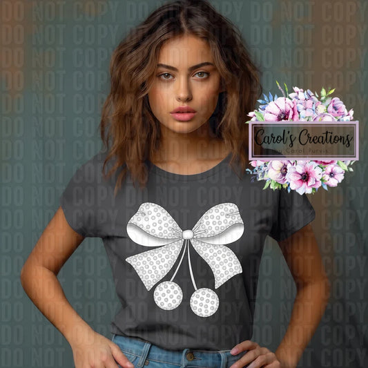 Woman wearing a dark gray t-shirt with a white bow design, standing against a dark background with 'DO NOT COPY' text.