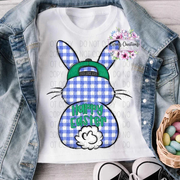 White t-shirt with blue gingham bunny design and 'Happy Easter' text, worn with denim jacket and basket of eggs.