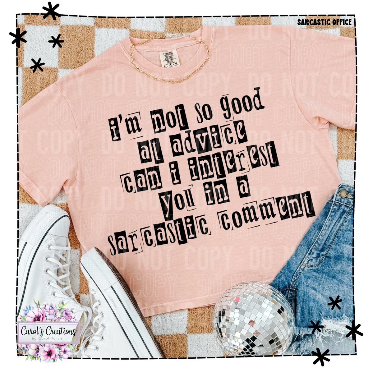 Pink t-shirt with humorous text on a checkered floor with sneakers and jeans.