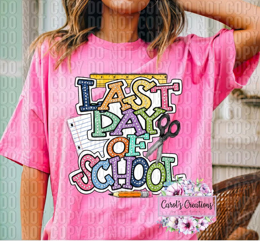 Person wearing a pink t-shirt with 'Last Day of School' design and 'Carel's Creations' branding.