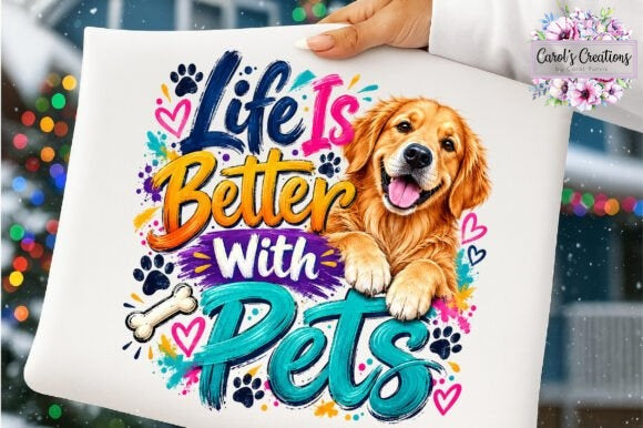 A white square pillow held by a hand, featuring a colorful graphic that reads 'Life Is Better With Pets' alongside a golden retriever illustration, paw prints, hearts, and bones. A 'Carol's Creations' logo is visible in the top right corner.
