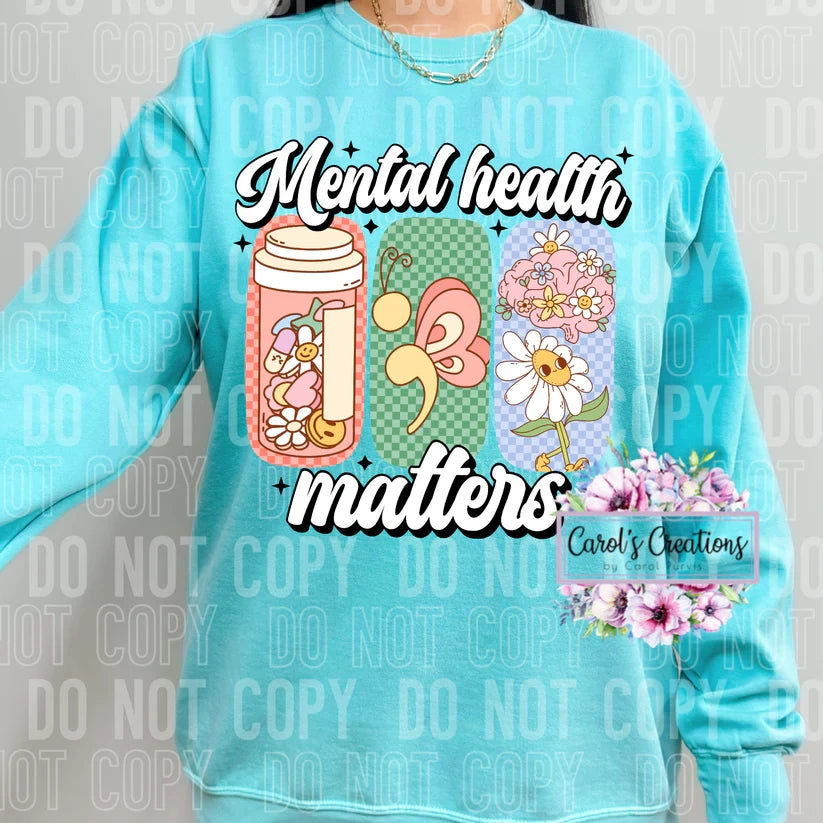 Light blue sweatshirt with 'Mental health matters' design and floral elements.