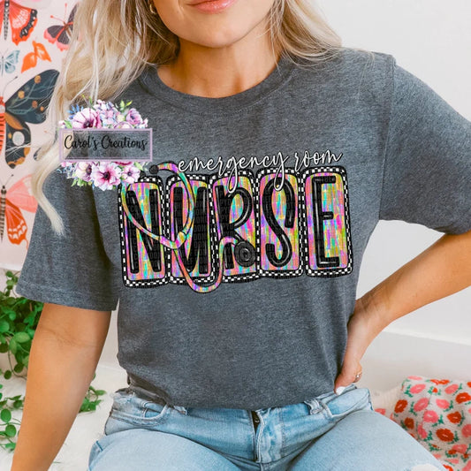 Person wearing a gray t-shirt with 'emergency room NURSE' text in colorful letters.