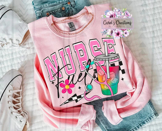 Pink shirt with 'NURSE' text and colorful design on a checkered background