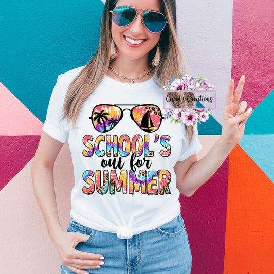 Woman wearing a 'School's out for Summer' t-shirt against a colorful geometric background