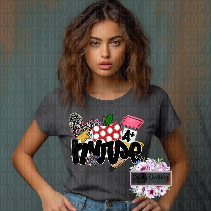 Woman wearing a dark gray t-shirt with colorful graphics and text, standing against a patterned background.