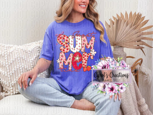 Woman wearing a blue t-shirt with colorful text, sitting on a couch with a decorative plant.