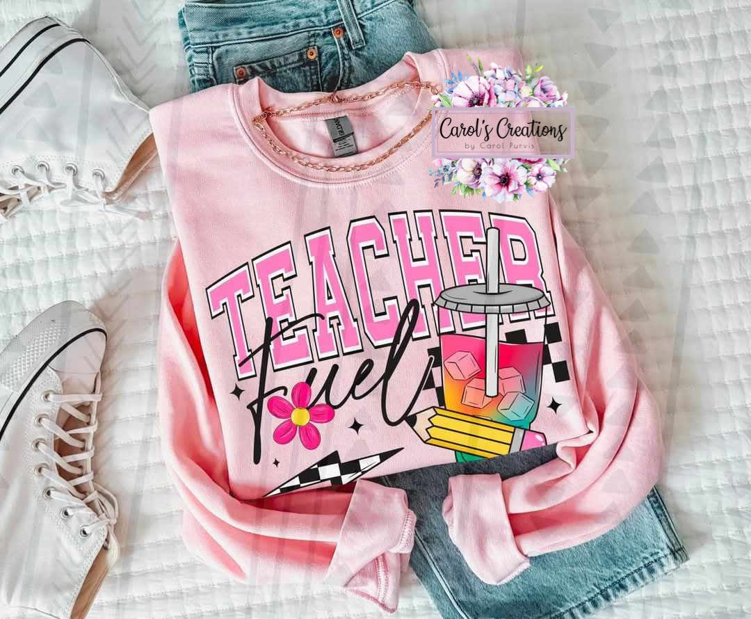 Pink sweatshirt with 'Teacher Fuel' design on a checkered background