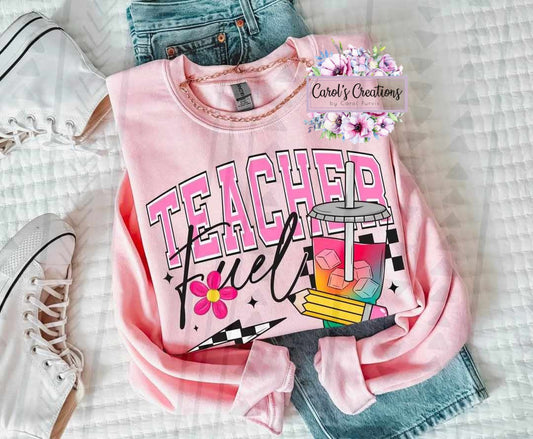 Pink sweatshirt with 'Teacher Fuel' design on a checkered background