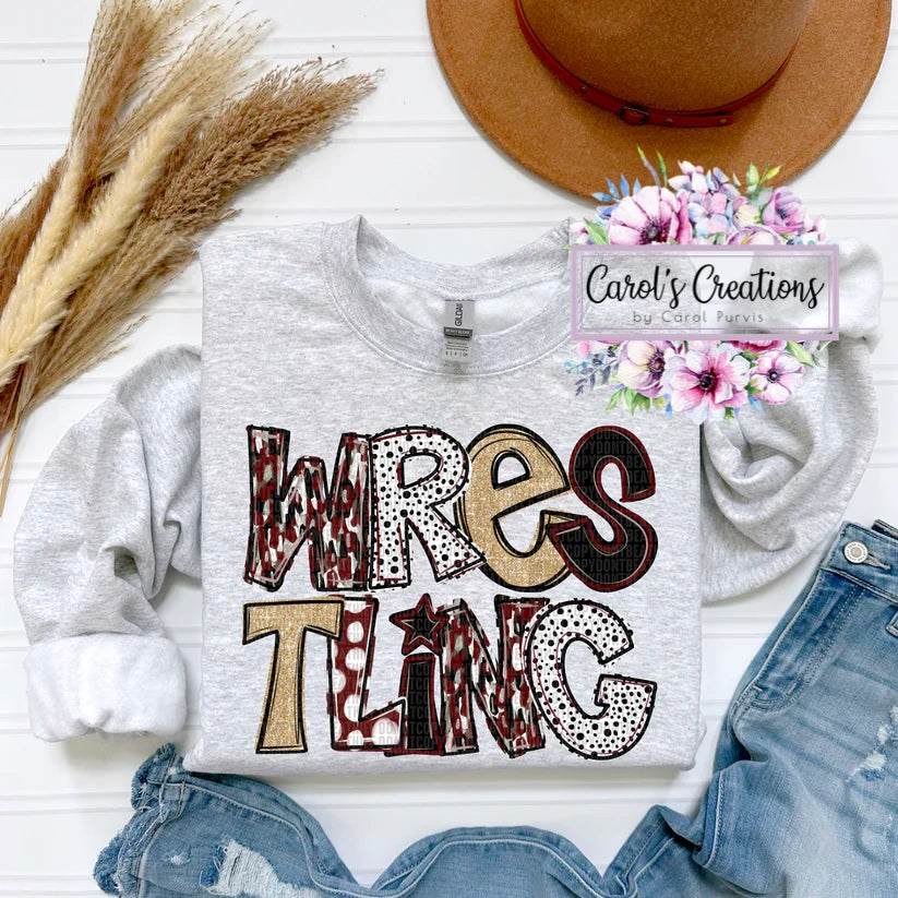 Gray sweatshirt with 'Wrestling' design, denim shorts, and a hat on a white surface.