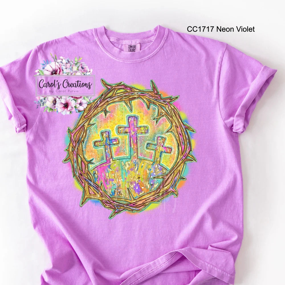 Purple t-shirt with colorful design and 'Carol's Creations' text on a white background