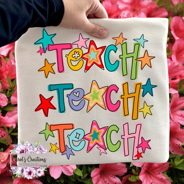 Canvas bag with 'TEACH' text in colorful letters held against a floral background