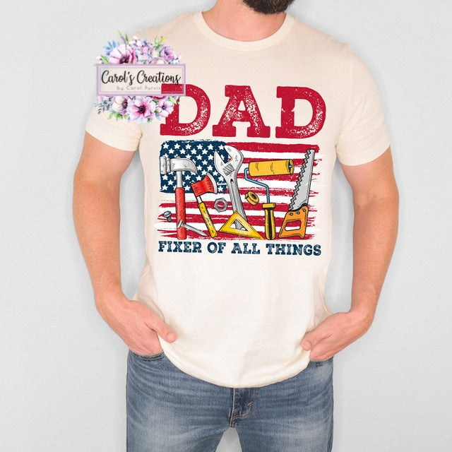Person wearing a t-shirt with 'DAD Fixer of All Things' design and American flag graphic.