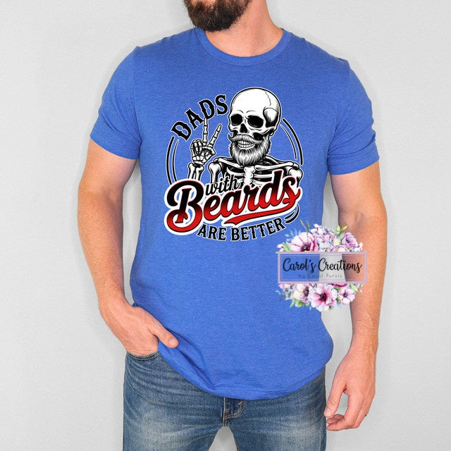 Person wearing a blue t-shirt with a graphic design and text, on a plain background.