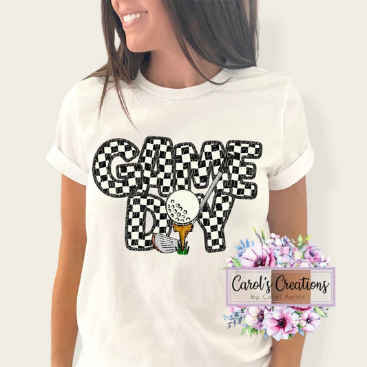 Person wearing a white t-shirt with 'GAME DAY' design and flowers in the corner.