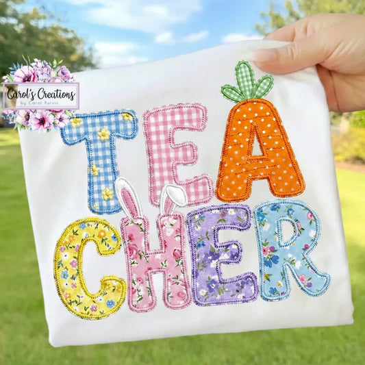 Embroidered patch with colorful letters spelling 'TEACHER' held outdoors.