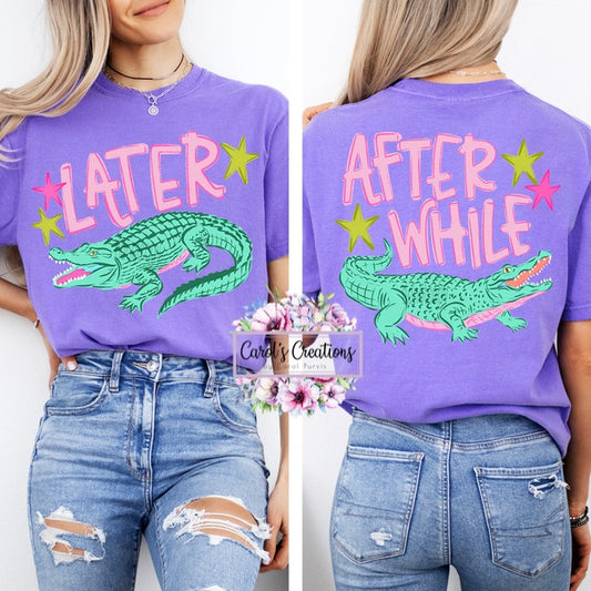 Purple t-shirt with alligator graphic and text 'LATER' and 'AFTER WHILE' on a white background.