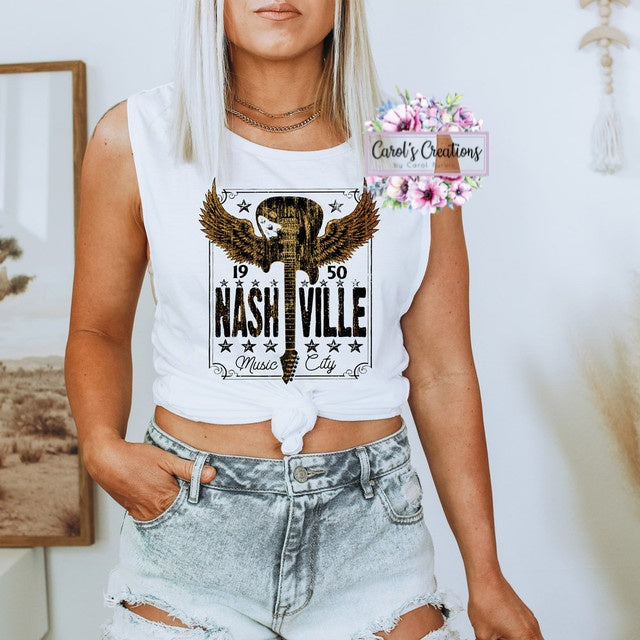 Person wearing a sleeveless shirt with 'Nashville' design, standing indoors.