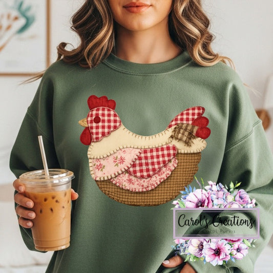 Person wearing a green sweatshirt with a rooster design, holding an iced coffee, in a casual setting.