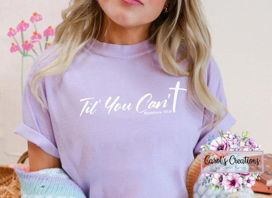 Person wearing a purple t-shirt with text, standing against a neutral background with floral decorations.