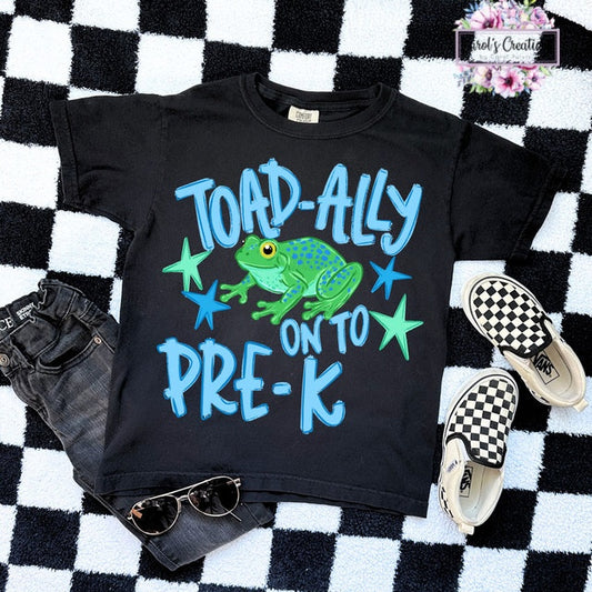 Black t-shirt with a frog graphic and text on a checkered background