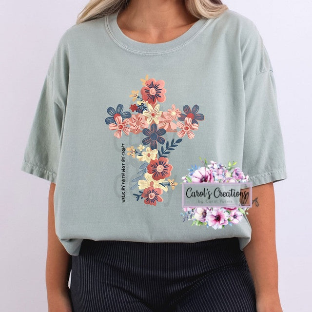Light blue t-shirt with floral design and text on a plain background